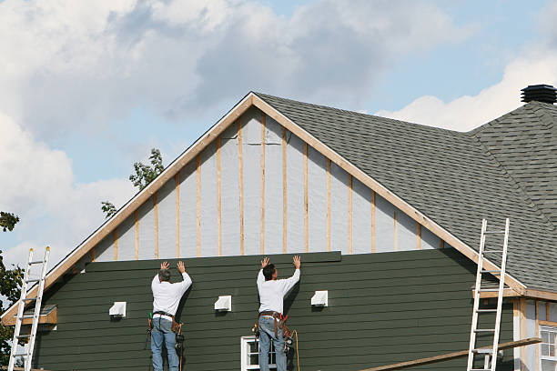 Professional Storm Damage Siding Repair technician working in Springboro, PA